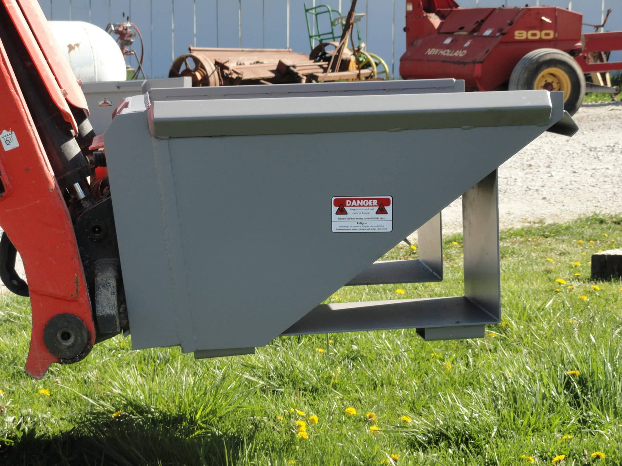 Quick attach hopper for skid steers